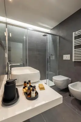 a bathroom with a sink and a tub and a toilet at Suite & Outdoor Patio - Colosseum & Fori Imperiali in Rome