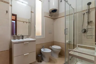 a bathroom with a toilet and a sink and a shower at GuestHost - Close to St Peter in Rome