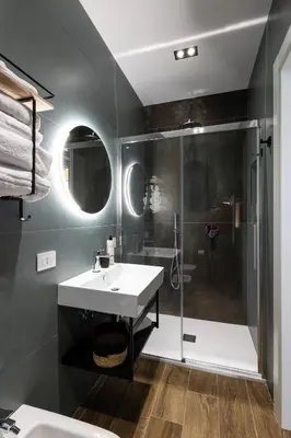 a bathroom with a sink and a shower at Style & Stone Guest House in Rome