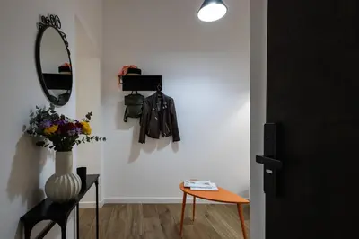 a room with a mirror and a table and a mirror at Style & Stone Guest House in Rome