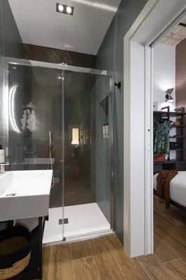 a bathroom with a shower and a sink at Style & Stone Guest House in Rome