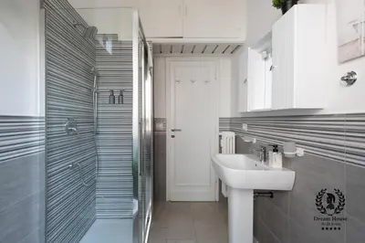 a bathroom with a sink and a shower at Dream House Re di Roma - 50mt to Metro Station, central position, 4pax, 2bdr in Rome