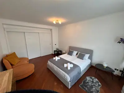 a bedroom with a bed and a couch and a chair at Vatican District, Roma, alloggio centrale in Rome