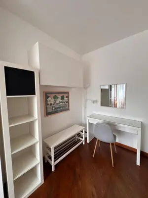 a white room with a desk and a chair at Vatican District, Roma, alloggio centrale in Rome