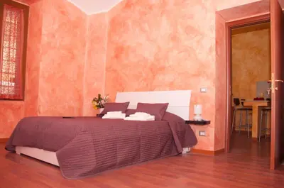 a bedroom with a large bed in a room at Lucky Domus Esquilino in Rome