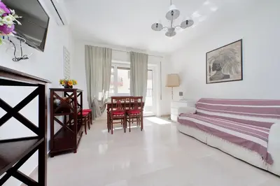a bedroom with a bed and a table and chairs at Vatican Francy's House - San Pietro Rome in Rome