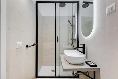 a bathroom with a sink and a shower at Urbana 24 in Rome