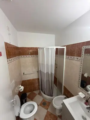 a bathroom with two toilets and a shower and a sink at ROMA Classica in Rome