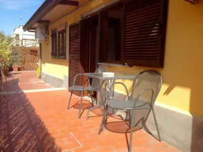 a table and chairs sitting on a brick patio at Appartamento con terrazza vicino al Vaticano in Rome
