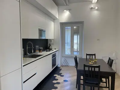 a kitchen with a table and a dining room at Veio Loft in Rome