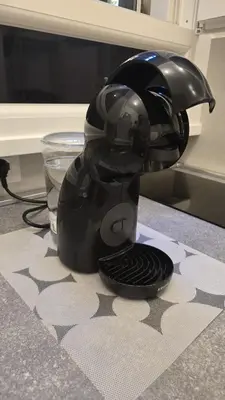 a black appliance sitting on top of a counter at Domus Regis Rooms in Rome
