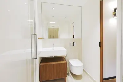 a bathroom with a white sink and a toilet at ​Easylife - Elegante trilocale in Piazza Navona in Rome