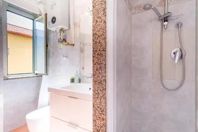a bathroom with a shower and a sink at Elegantis Labicana Apartment - Few steps from the Colosseum in Rome