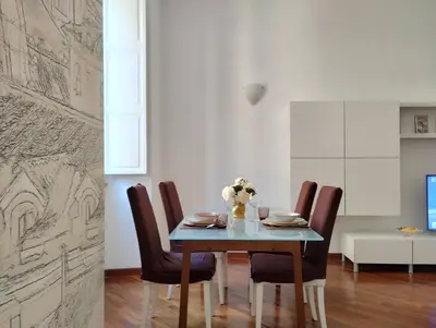 a dining room with a table and chairs at Dimora Roma Eterna, vacation & business in Rome