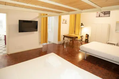 a living room with a bed and a piano at Manara10 Apart giallo2 in Rome