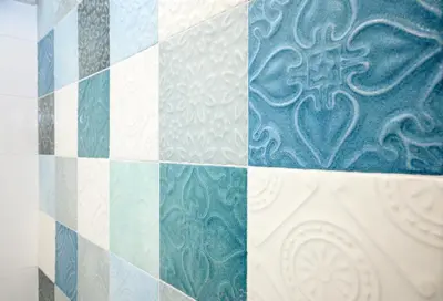 a blue and white tile wall with a heart on it at Magnoliahome Suites at the Vatican in Rome