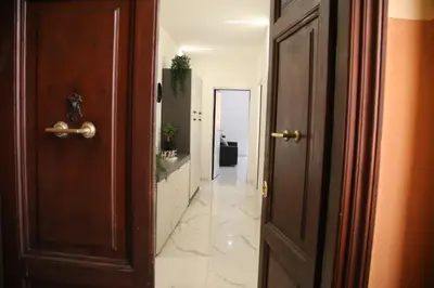 an open door to a hallway with a hallway leading into a room at Emma and Livia's Vatican Suite 2 in Rome