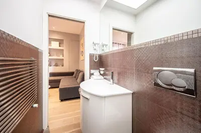a bathroom with a sink and a toilet in a room at Casa Sistina in Rome