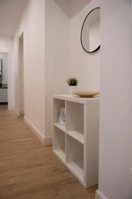 a room with a white table and a mirror at Appartamento Roma - Bredi Home in Rome
