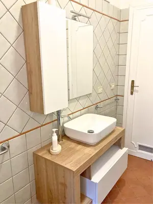 a bathroom with a sink and a mirror at Terracito! in Rome
