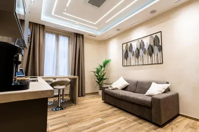 a living room with a couch and a table at Paci Luxury Suite in Rome