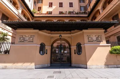 an entrance to a building with a black gate at Paci Luxury Suite in Rome