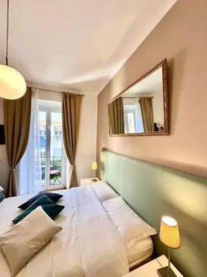 a bedroom with a large bed with a large mirror at Vacanze Romane Basilica in Rome