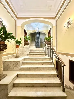 a staircase in a house with plants at Vacanze Romane Basilica in Rome
