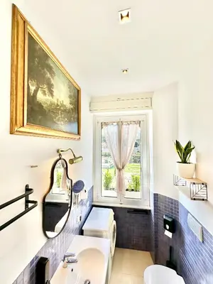 a bathroom with a sink and a window at Vacanze Romane Basilica in Rome
