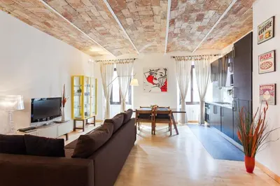 a living room with a couch and a table at Roma Pizza & Mandolino in Rome