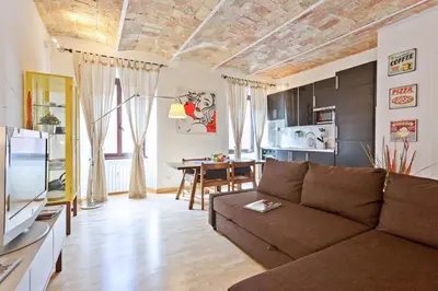 a living room with a couch and a table at Roma Pizza & Mandolino in Rome