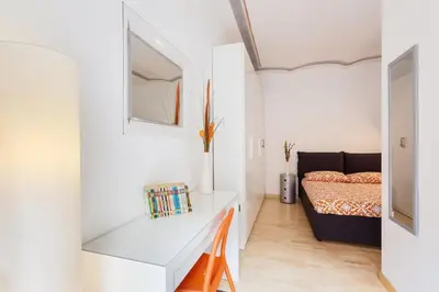 a room with a desk and a bed in a room at Roma Pizza & Mandolino in Rome