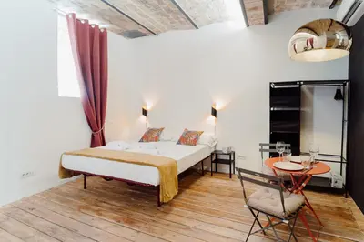 a bedroom with a bed and a table and chair at Monti Urban Studio by Valentina's Dream in Rome