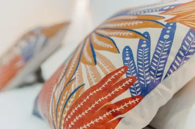 a close up of a tie with feathers on it at Monti Urban Studio by Valentina's Dream in Rome