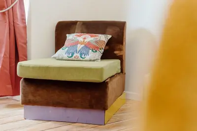 a chair with a pillow sitting on top of it at Monti Urban Studio by Valentina's Dream in Rome