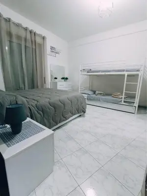 a living room with a bed and a couch at Asia Guest House in Rome