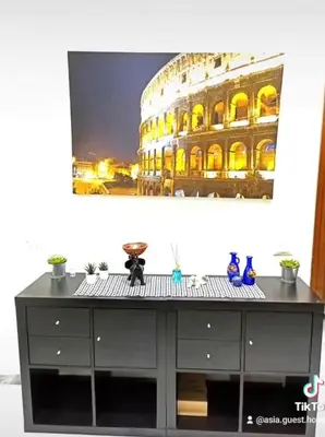 a black cabinet with a building in the background at Asia Guest House in Rome