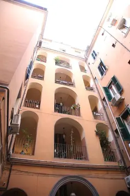a tall building with balconies and plants on it at Emma and Livia's Vatican Suite 1 in Rome