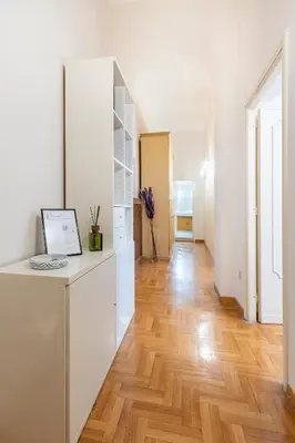 a white office with a desk in a room at Maison Villa Borghese in Rome