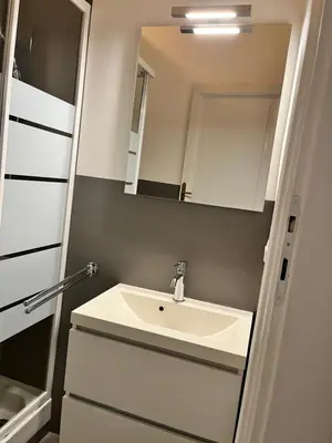 a bathroom with a sink and a mirror at Gianicolo Hill Apartment in Rome
