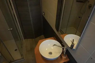 a bathroom with a sink and a mirror at Casa Cycas in Rome
