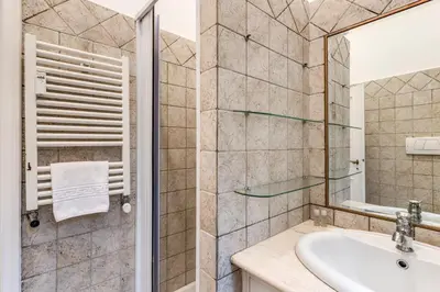 a bathroom with a sink and a mirror at Residenza Ripetta in Rome
