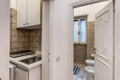 a small kitchen with a sink and a toilet at Residenza Ripetta in Rome