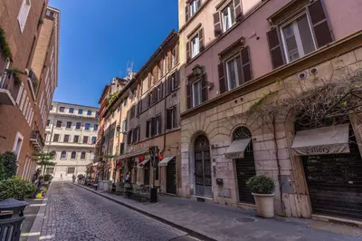 an empty street in a city with buildings at Residenza Ripetta in Rome