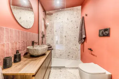 a bathroom with a sink and a toilet and a mirror at Otium Urbano in Rome