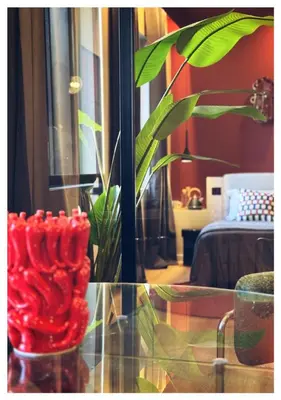 a glass table with a plant in a room at Otium Urbano in Rome