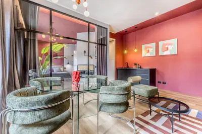 a dining room with a glass table and chairs at Otium Urbano in Rome