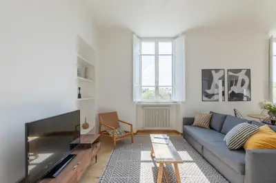 a living room with a couch and a tv at iFlat Bright & Modern Living with Panoramic View in Rome