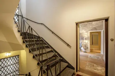 a staircase in a house with a glass door at BeSecret Belsiana in Rome