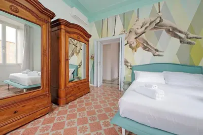 a bedroom with a bed and a large mirror at Modern retreat with Spectacular St Peter's views in Rome
